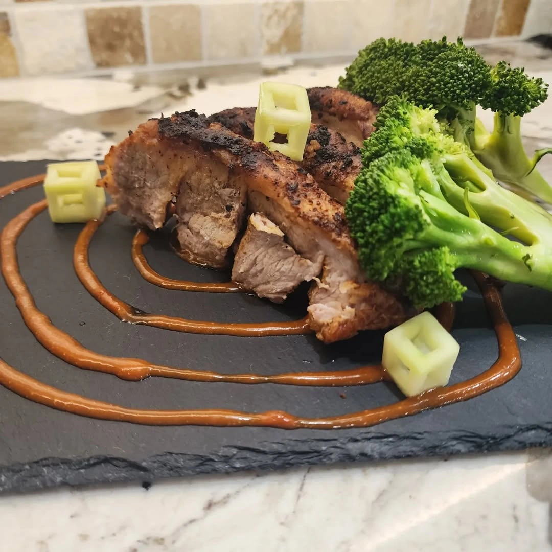 Accordian Cut Pork Belly with Steam Broccoli and Reduced Spicy Tomato Sauce